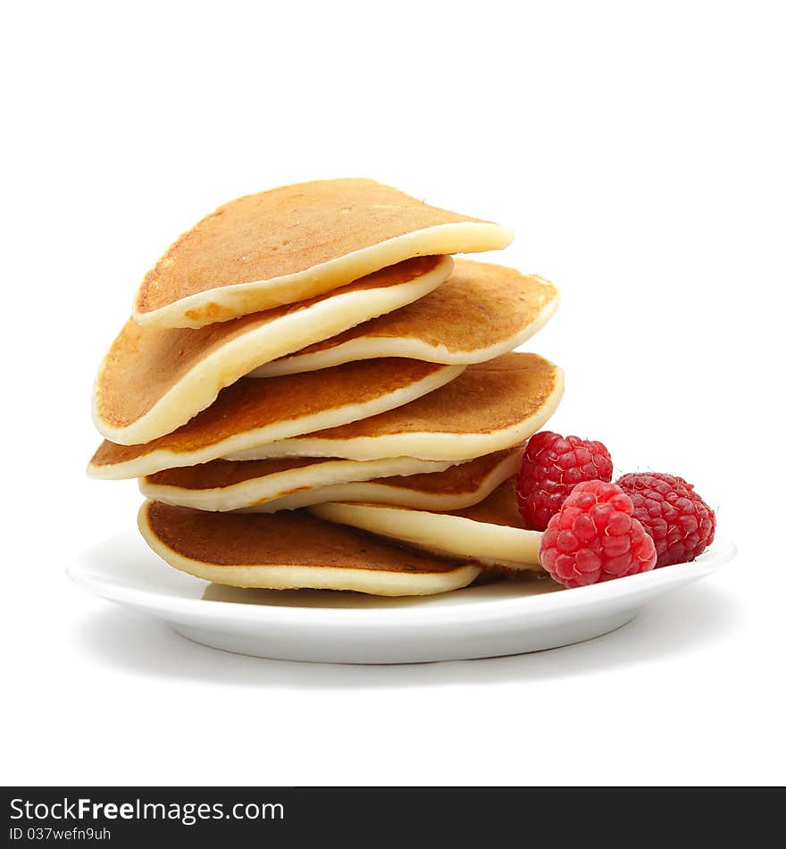 Small pancakes with berries isolated