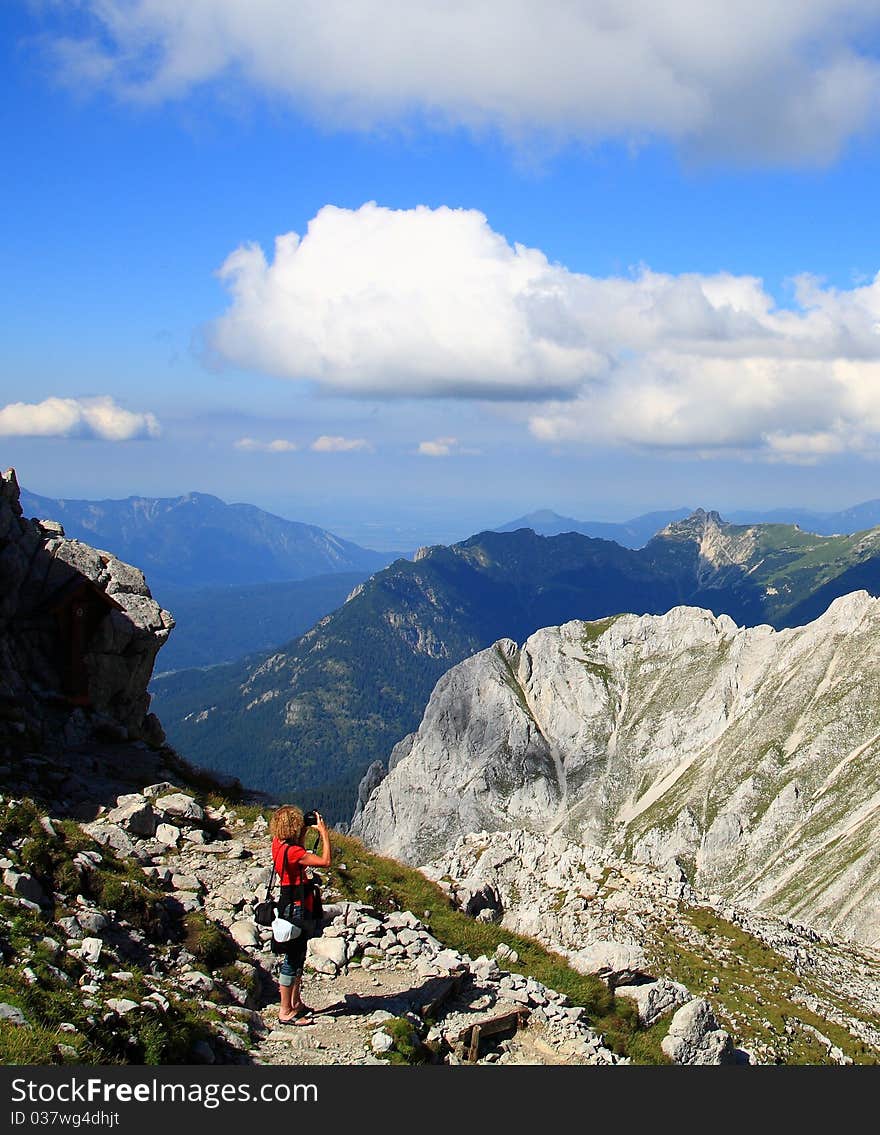 Woman and camera in alps