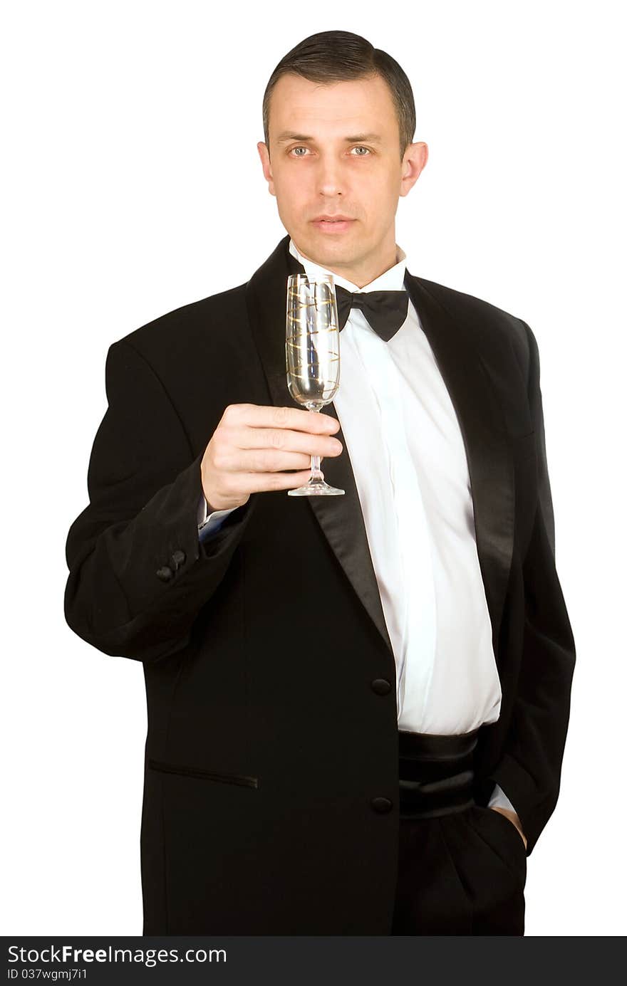 The imposing man in a classical tuxedo with a wine glass