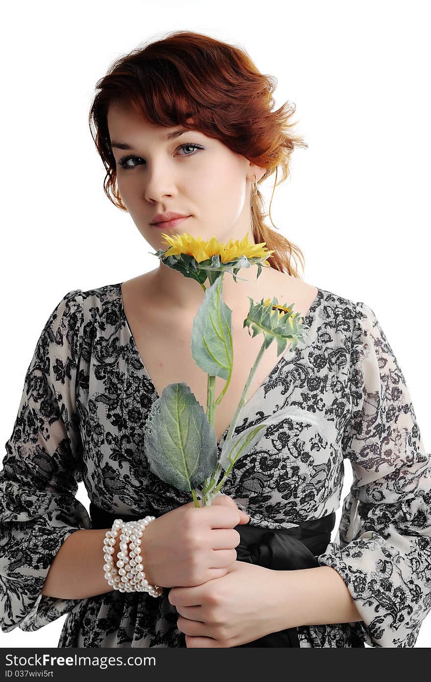 An image of young woman with yellow flower. An image of young woman with yellow flower