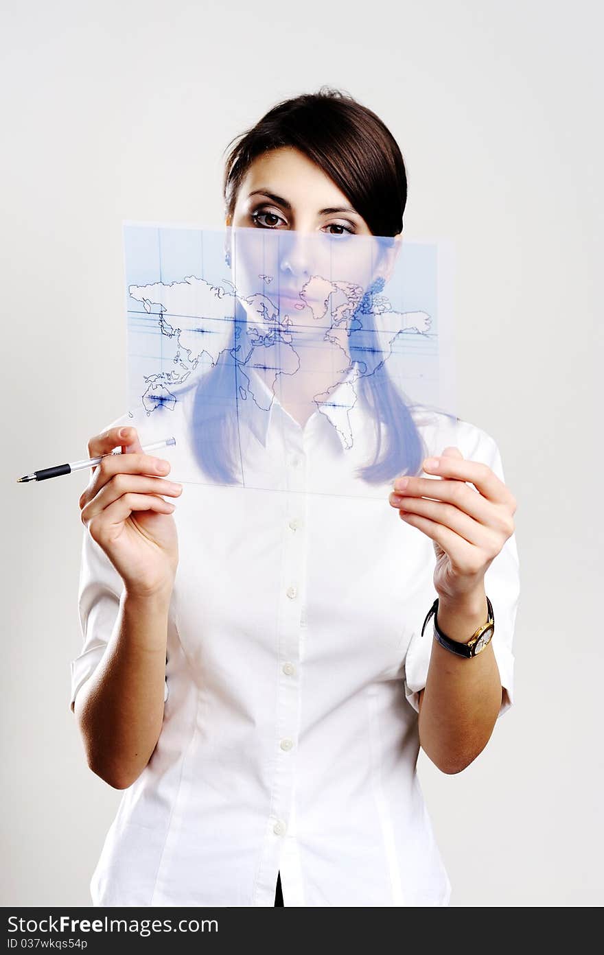 A girl holding a map of the world. A girl holding a map of the world