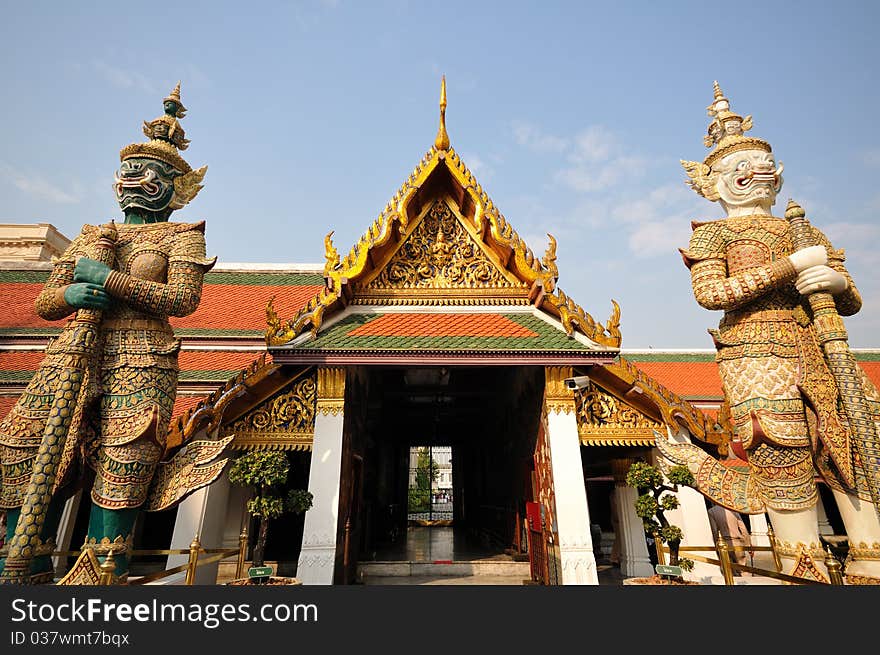 Twin guardian statues at Wat Phra-Kaew in Bangkok, Thailand