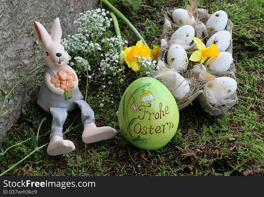 Easter bunny and easter eggs in the garden