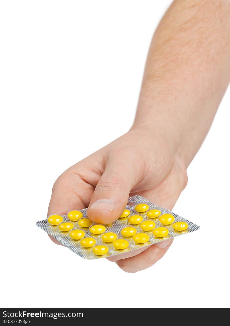 Hand with pills isolated on white background