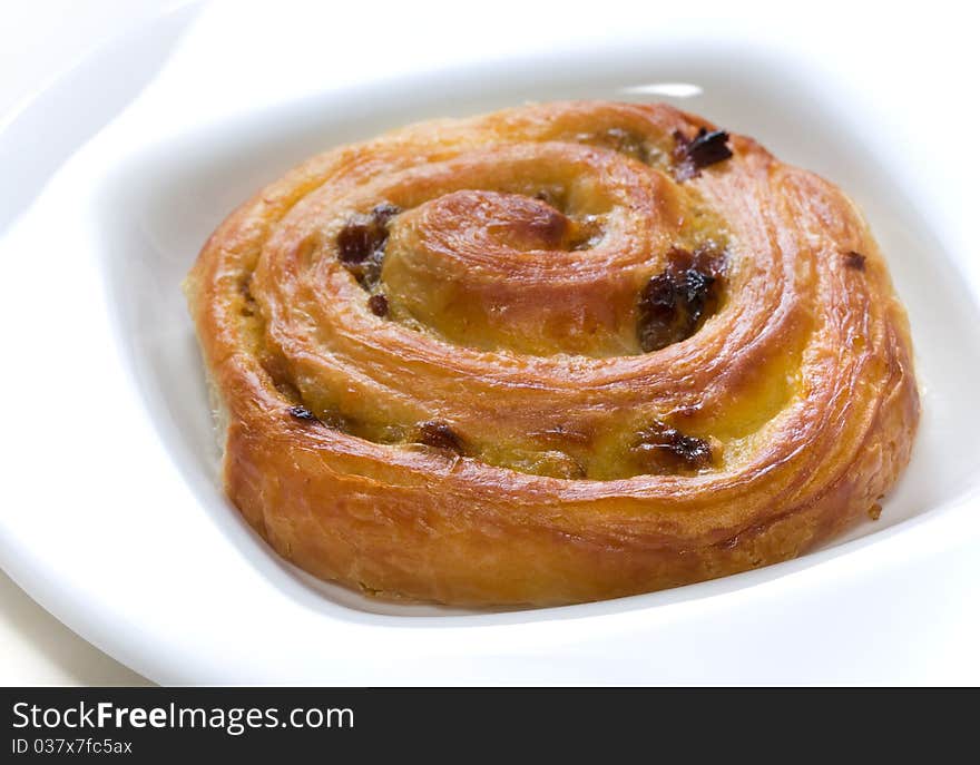 Escargot or pain aux raisines with low depth of field