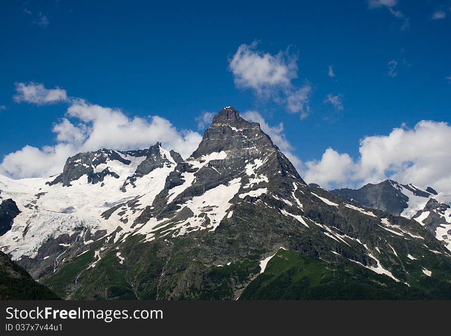 Panoramic view from dombay,blue sky with clouds