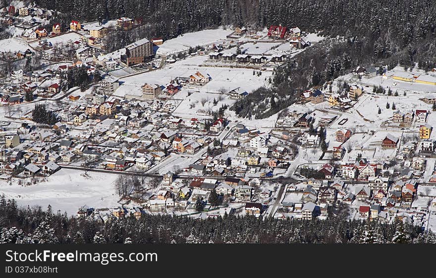 A small city covered with snow during winter. A small city covered with snow during winter