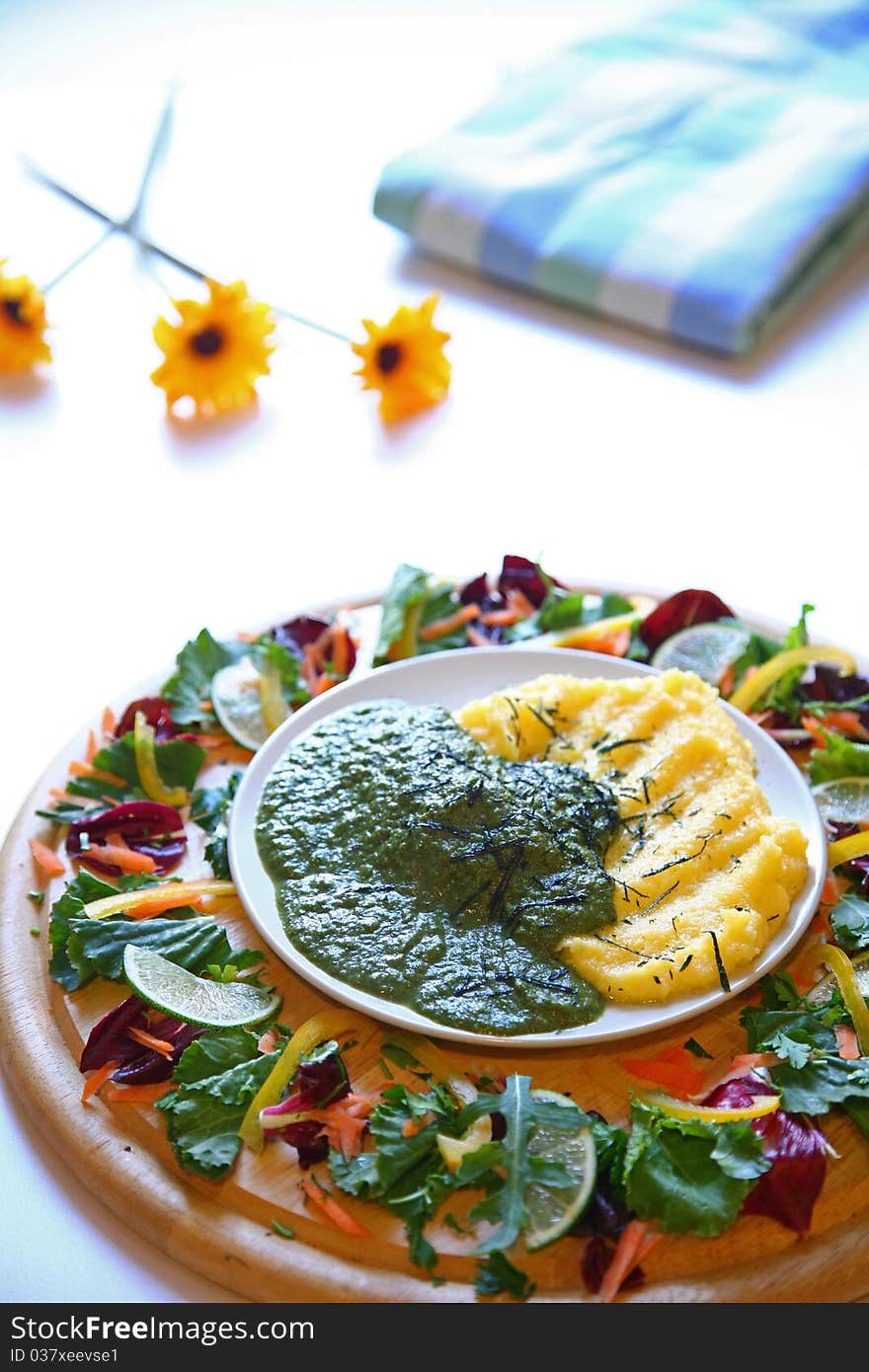 Vegetables on a wooden plate. Vegetables on a wooden plate