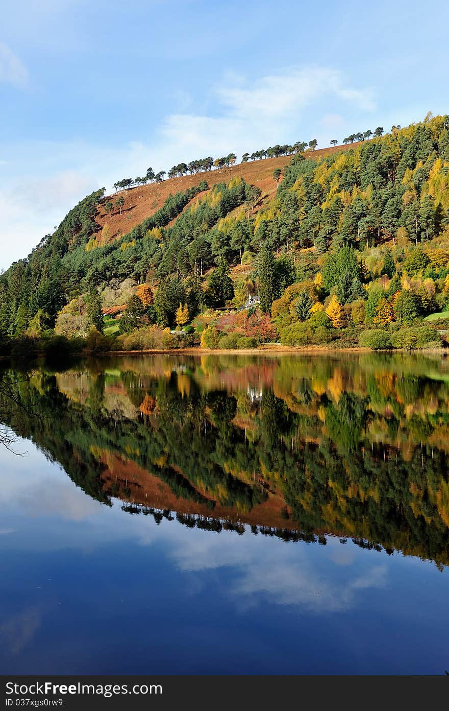 Reflection of the sky and landscape in the lake. Reflection of the sky and landscape in the lake