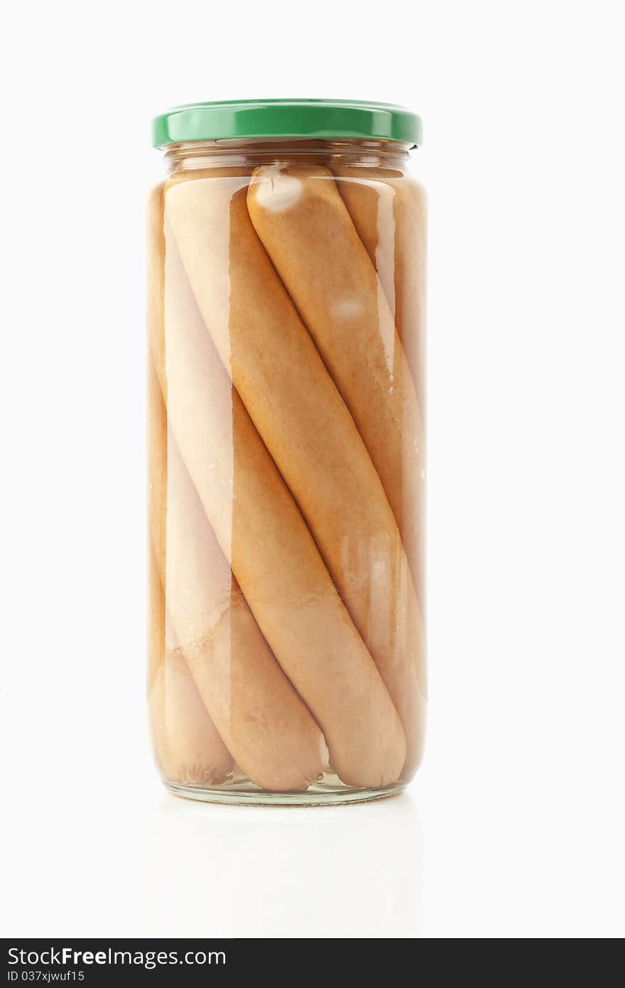 Sausages in a glass on white background