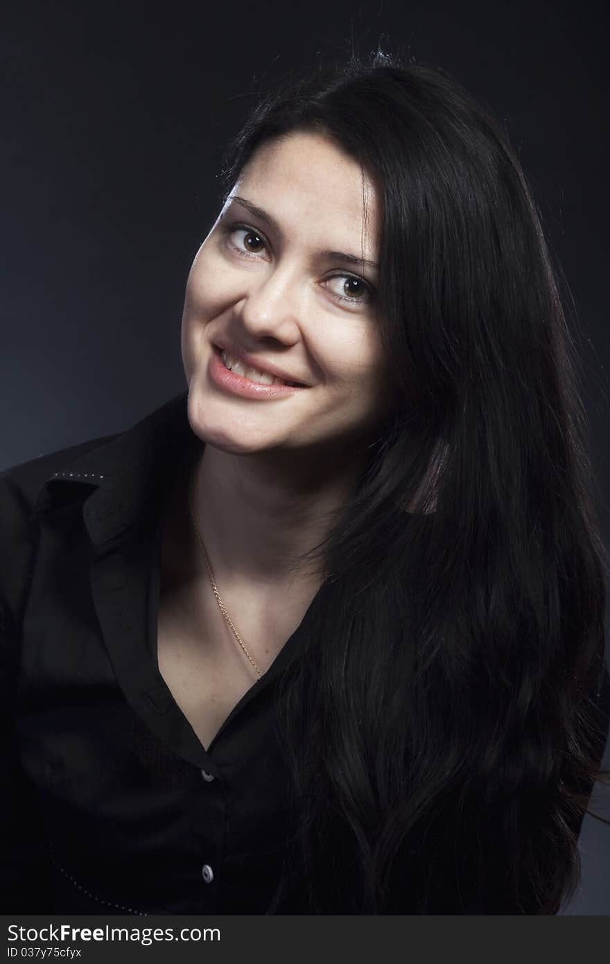 Portrait of beautiful brunette woman in studio