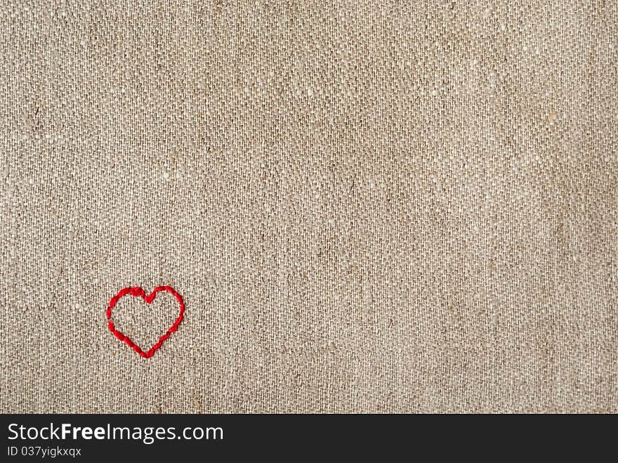 Canvas background with an embroidered red heart