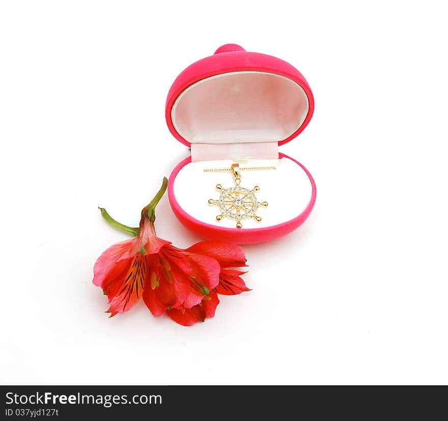 Pendant form of heart in a red box astromeria lily. Pendant form of heart in a red box astromeria lily