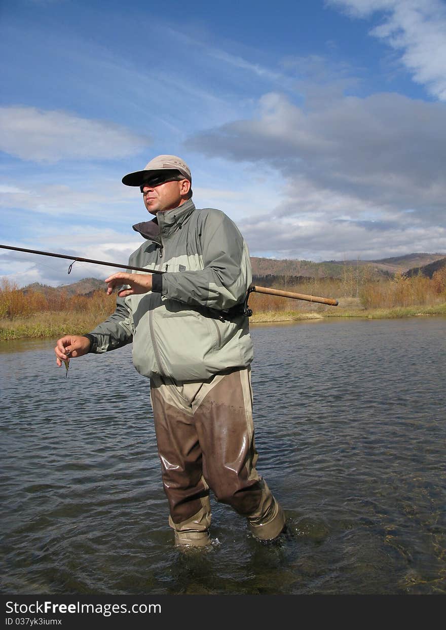 Fishing - fisherman cath on river