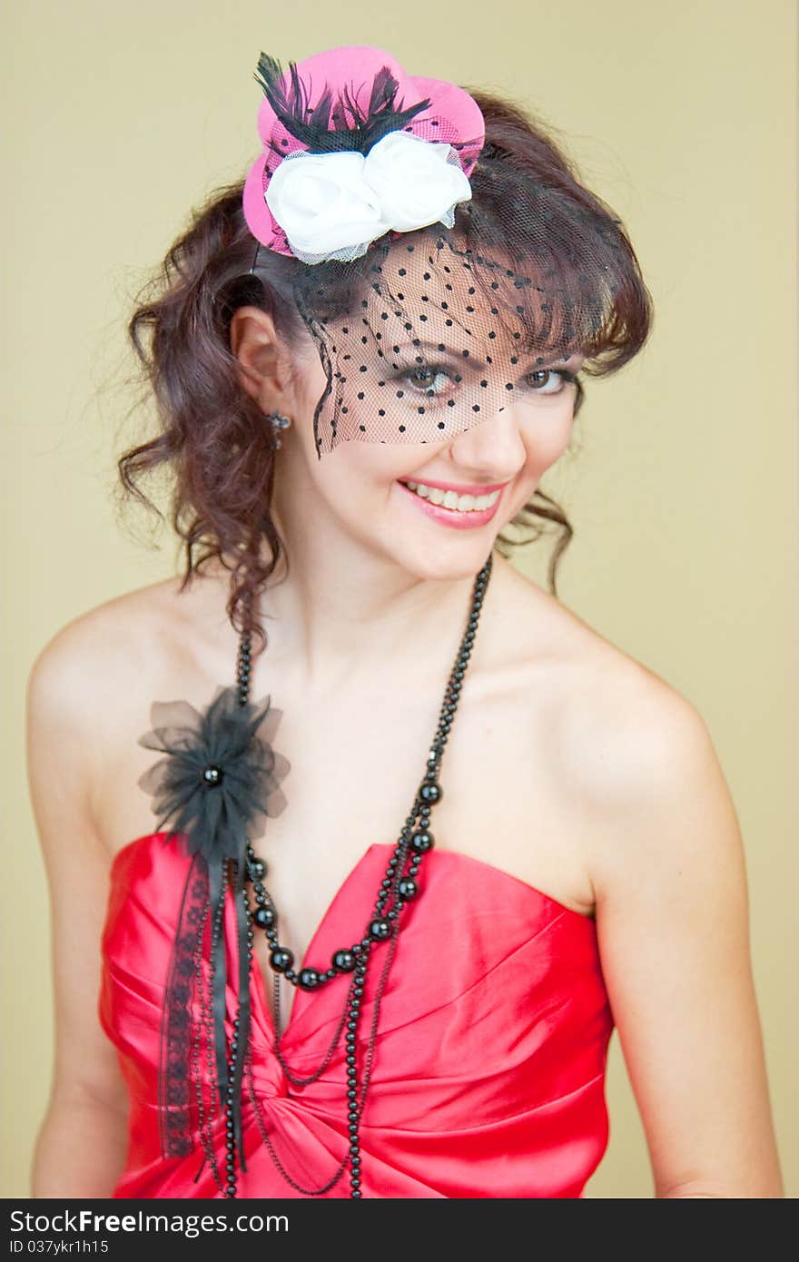 Beautiful girl in pink hat with veil