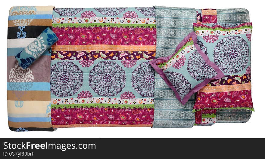 Top view of a colorful bed spreads. Top view of a colorful bed spreads.