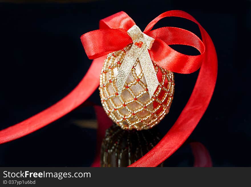 Eggs decorated with beads over the black background. Eggs decorated with beads over the black background