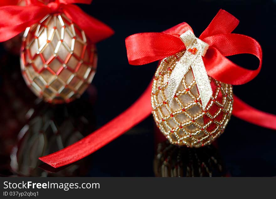 Eggs decorated with beads over the black background. Eggs decorated with beads over the black background