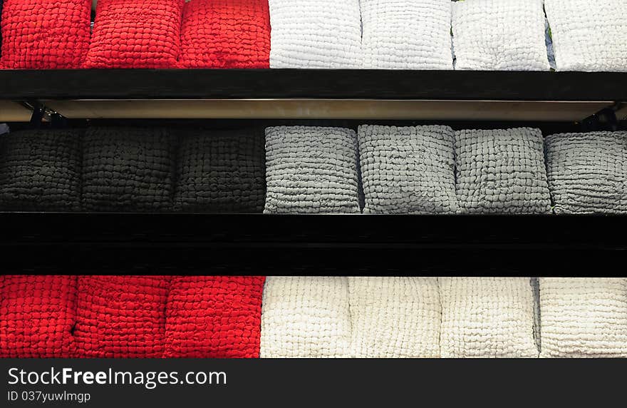 Stack of soft cushions on shelves. Stack of soft cushions on shelves.