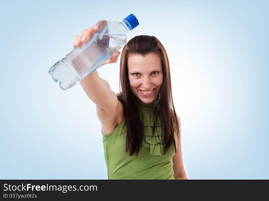 Young woman drinking bottled mineral water. Young woman drinking bottled mineral water