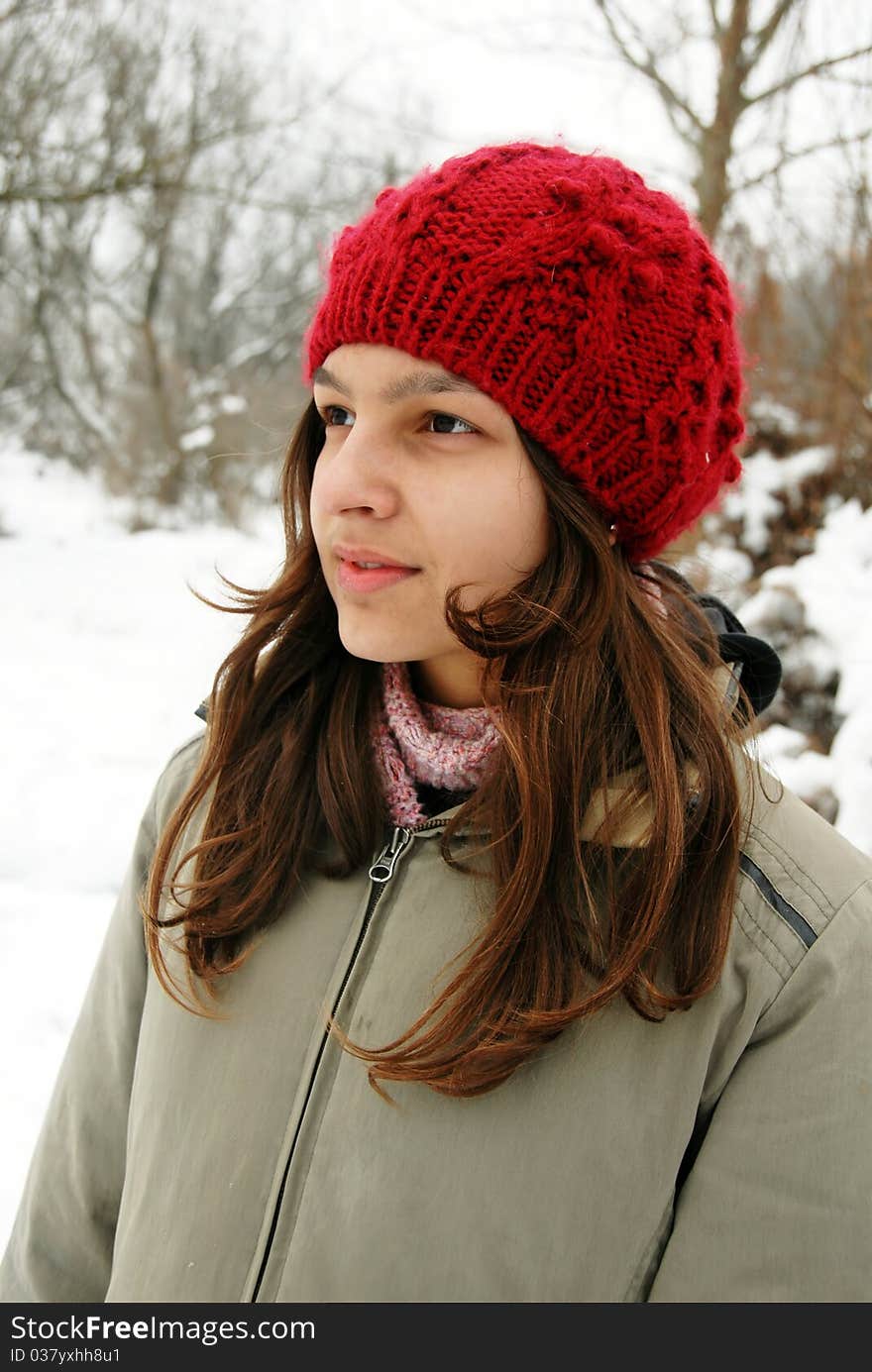 Teenage smiling caucasian girl in red cup outdoor. Teenage smiling caucasian girl in red cup outdoor