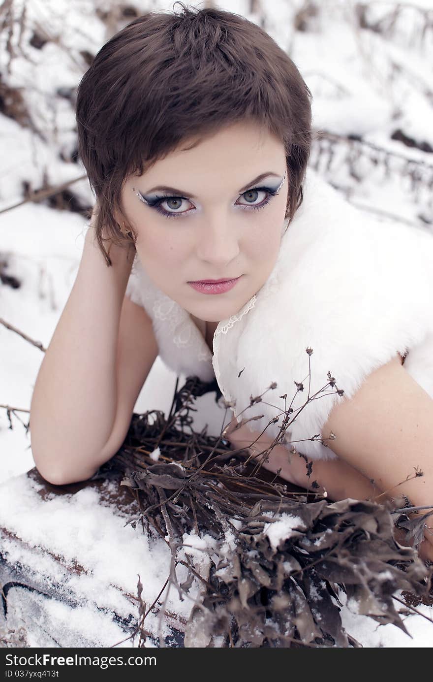 Beautiful girl bride on the street in the snow. Beautiful girl bride on the street in the snow