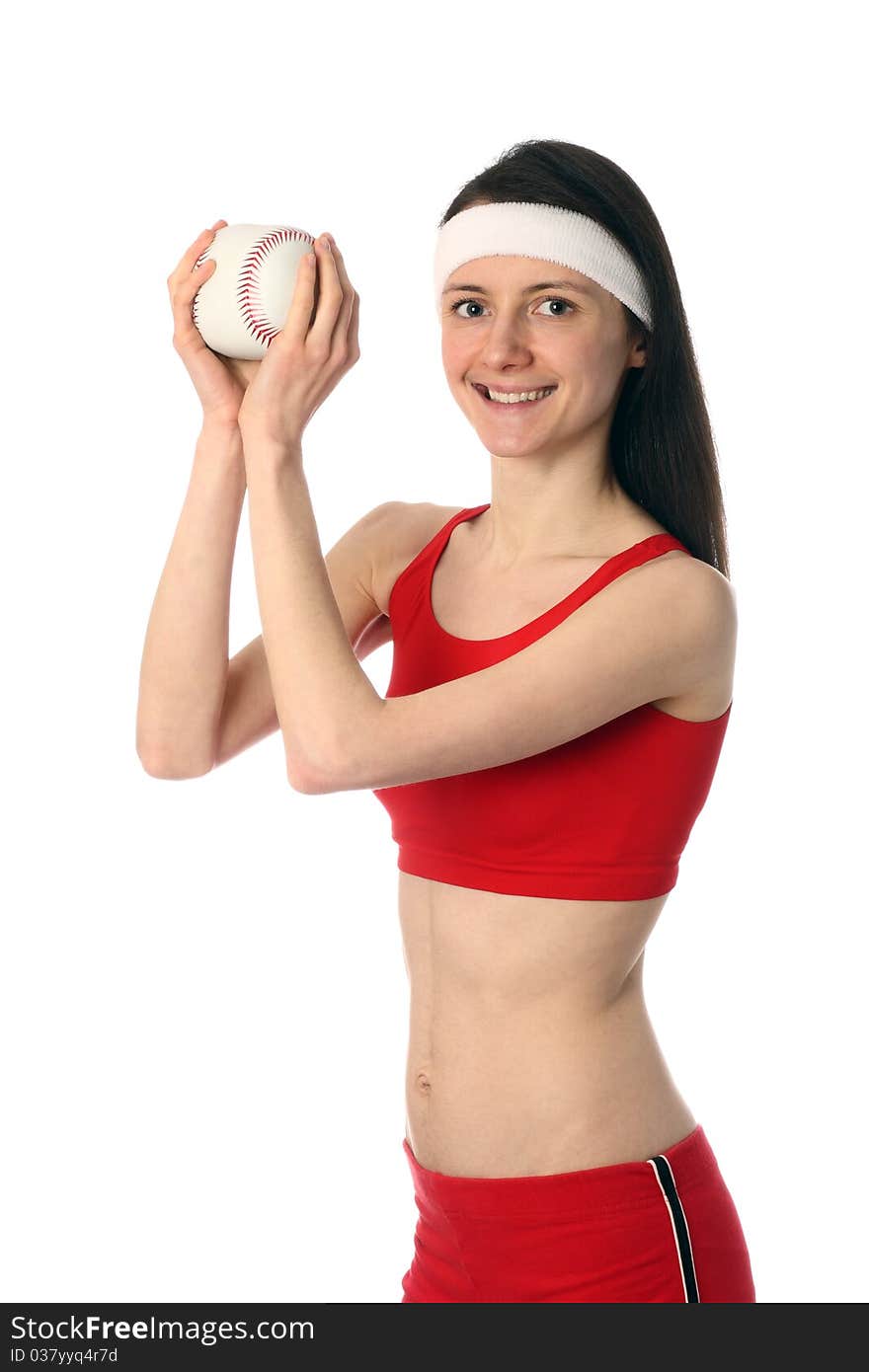 Happy young woman in red sport clothes exercising with a small ball; isolated on white. Happy young woman in red sport clothes exercising with a small ball; isolated on white