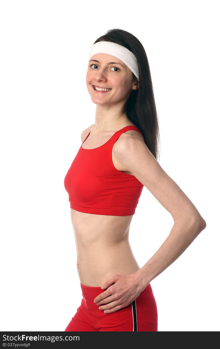 Happy young woman in red sport clothes exercising; isolated on white. Happy young woman in red sport clothes exercising; isolated on white