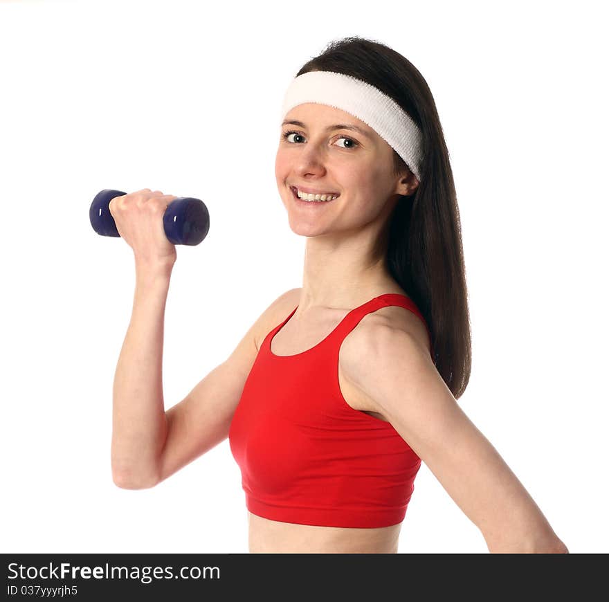 Happy young woman in red sport clothes exercising with a dumbbell; isolated on white. Happy young woman in red sport clothes exercising with a dumbbell; isolated on white