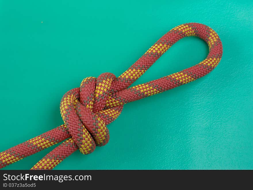 Colorful knot on the green background