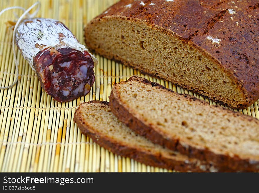 Salami sausage with homemade whole wheat bread sliced