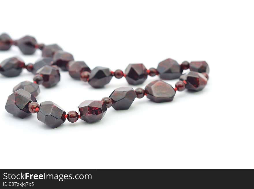 Garnet necklace isolated on a white background