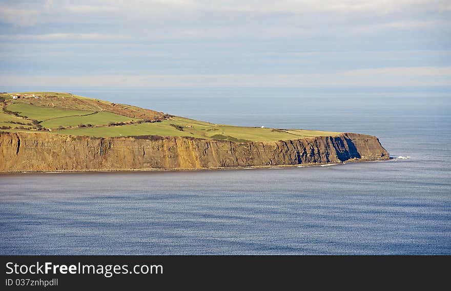 Part of coastline on a clear day