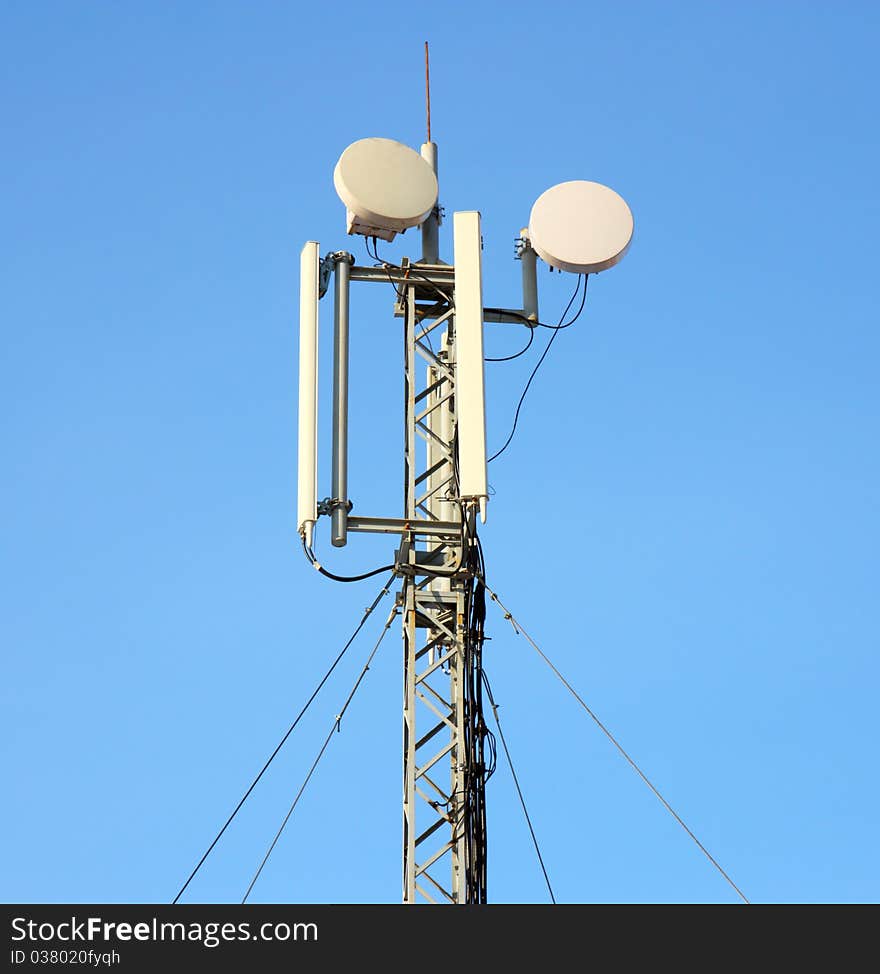 Aerial mobile communication  against the blue sky