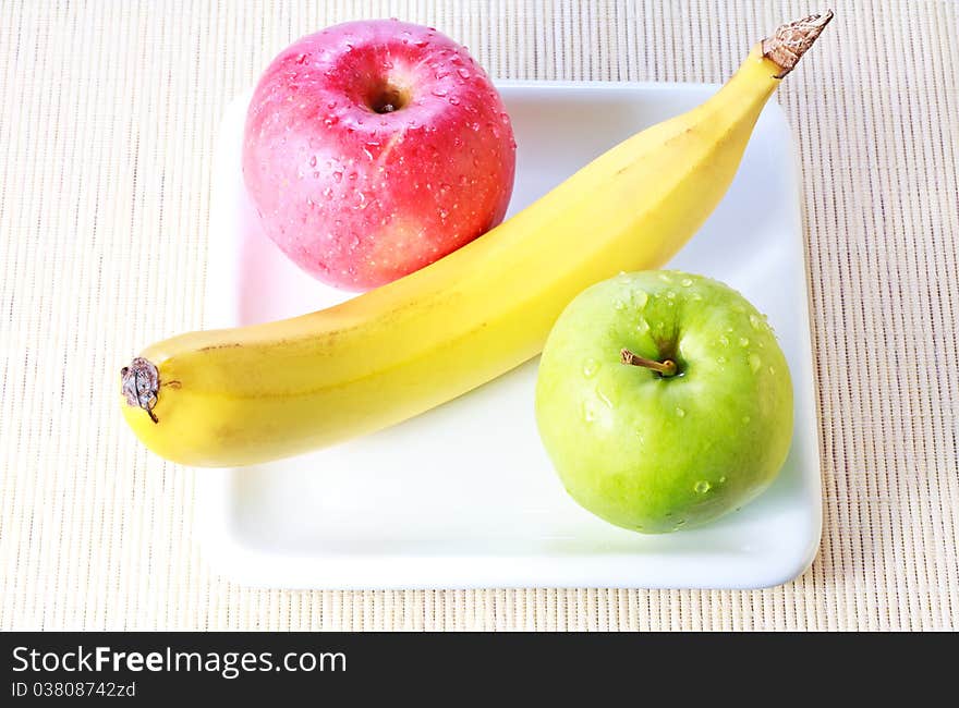 Banana, Green And Red Apples On Plate