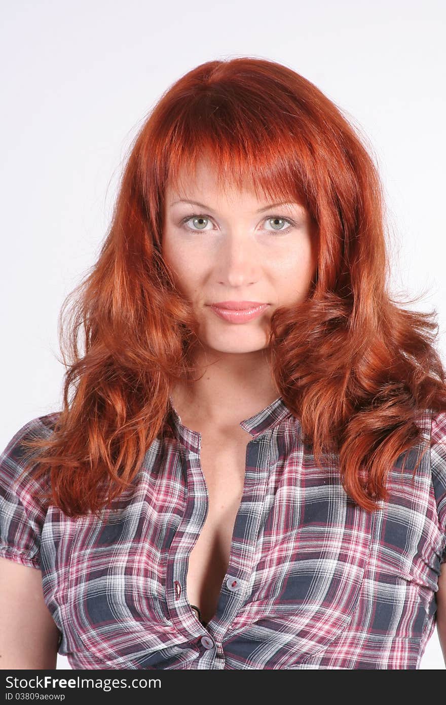 Portrait of beautiful young redheaded woman