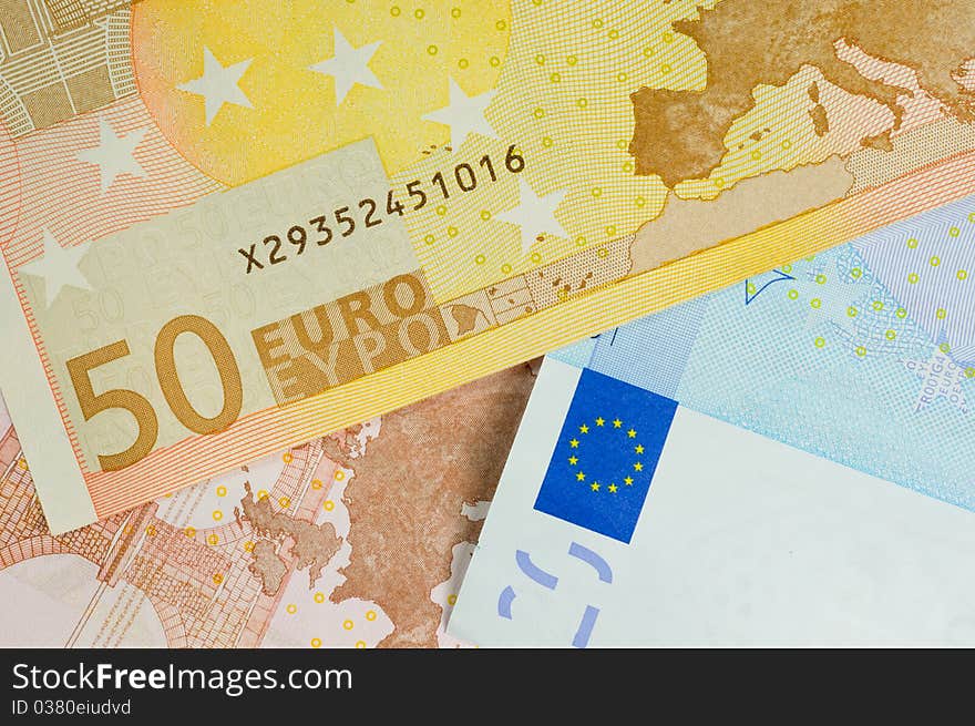 Macro shot showing uro currency with the flag map and the fifty euro denomination. Macro shot showing uro currency with the flag map and the fifty euro denomination