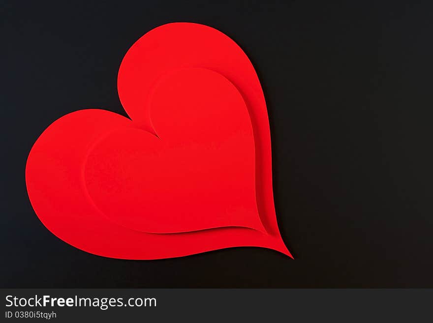 Red hearts isolated in a black background