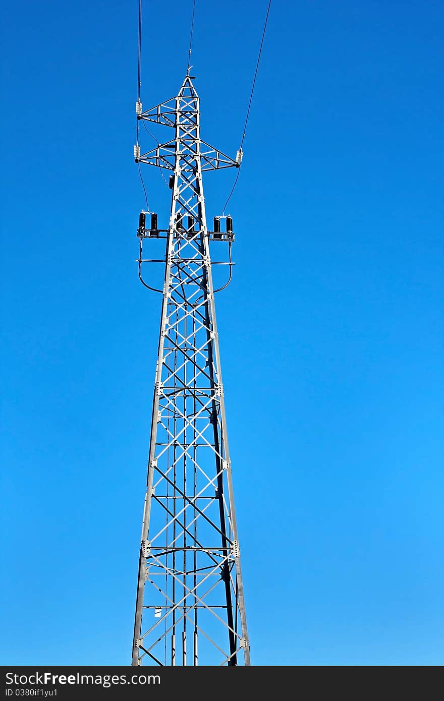 Tower of high voltage electric power with blue sky as background