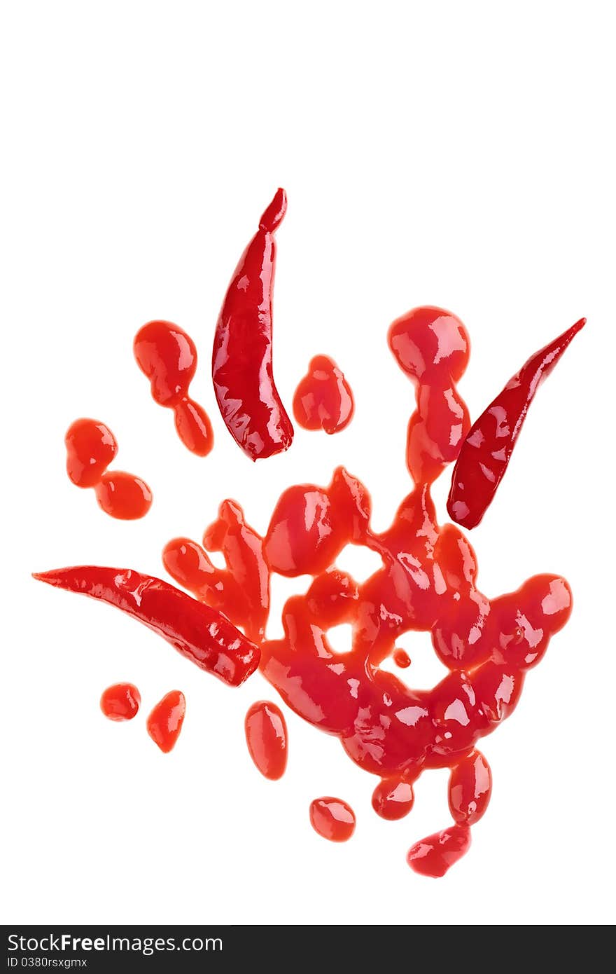 Red chili pepper and sauce isolated over white