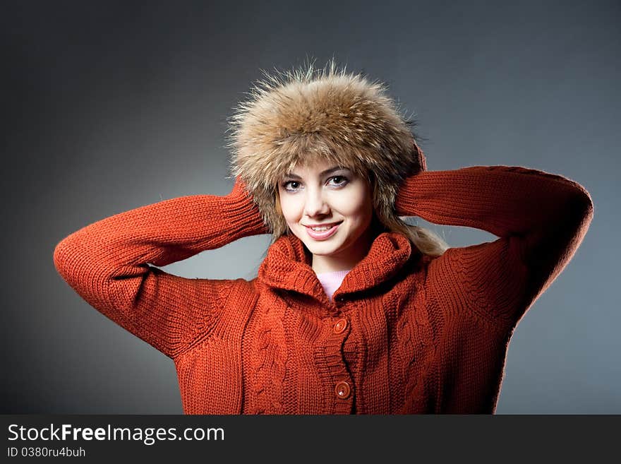 Young beautiful girl rejoices to snow, On a dark blue background