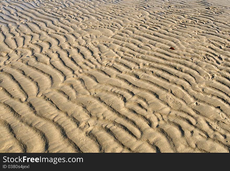 Sandy background with flows. Coast.