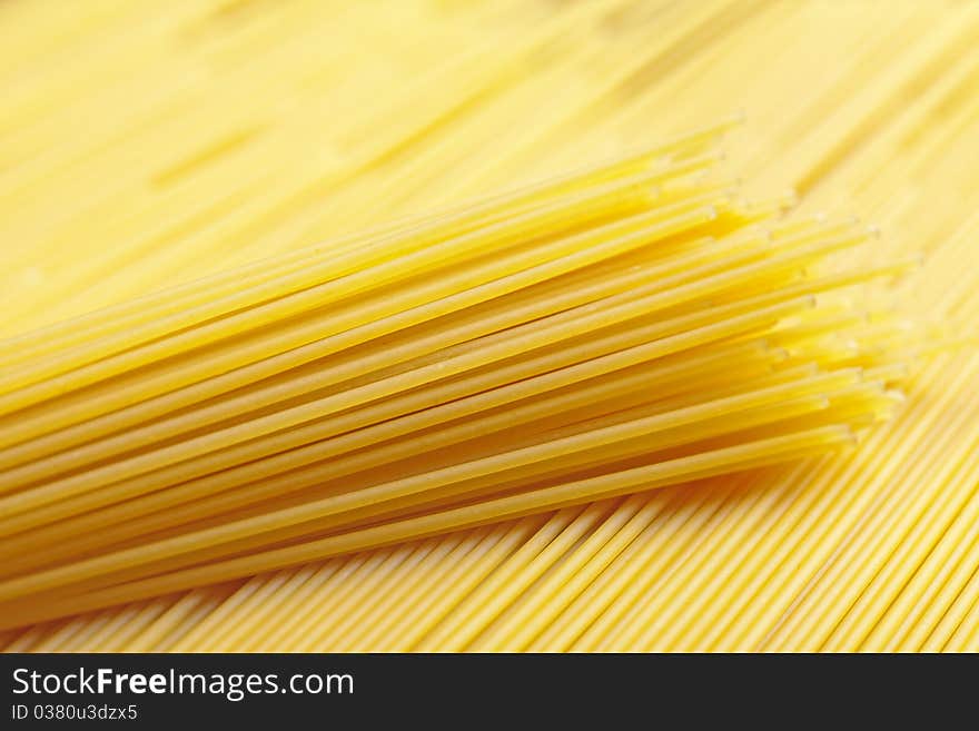 A bunch of spaghetti, uncooked spaghetti noodles background