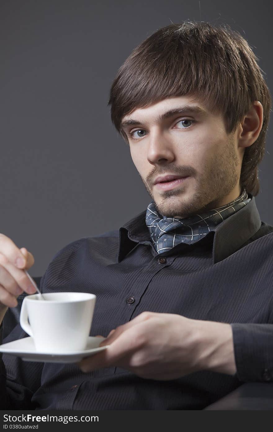 Man with cup coffee