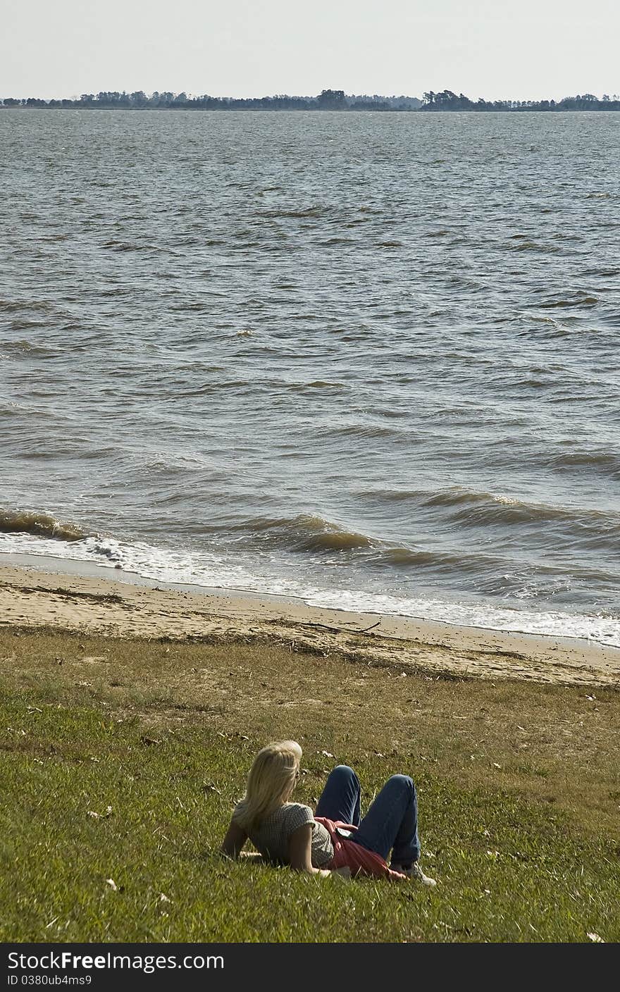 Woman relaxing on summer day along James River in Virginia