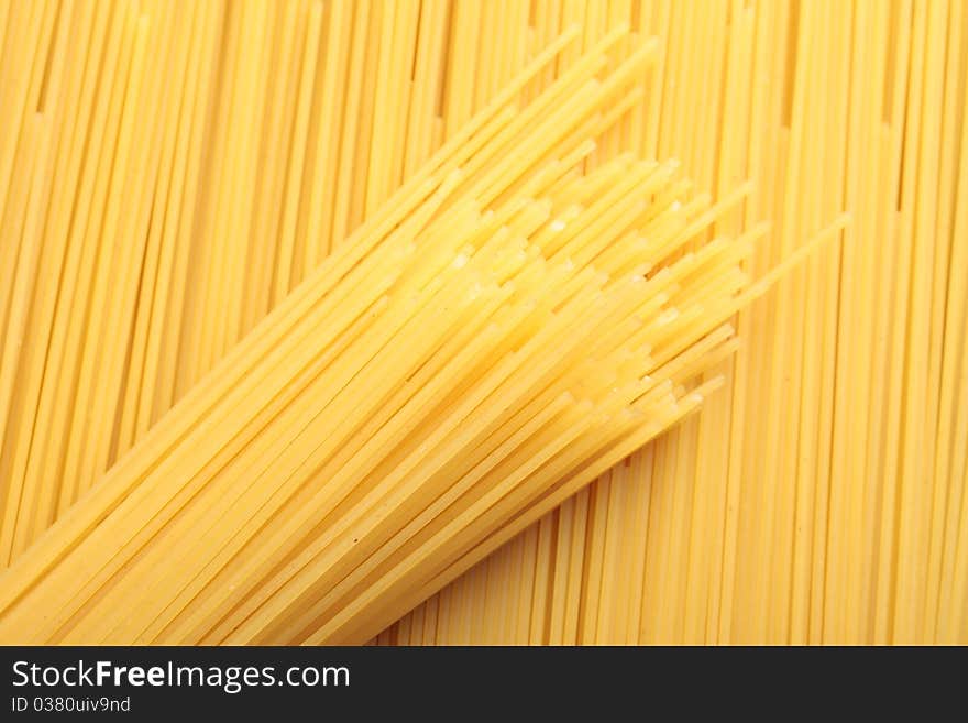 A bunch of spaghetti, uncooked spaghetti noodles background