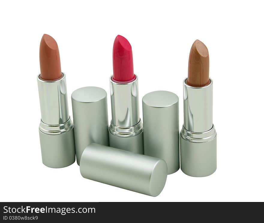 Three lipsticks on a white