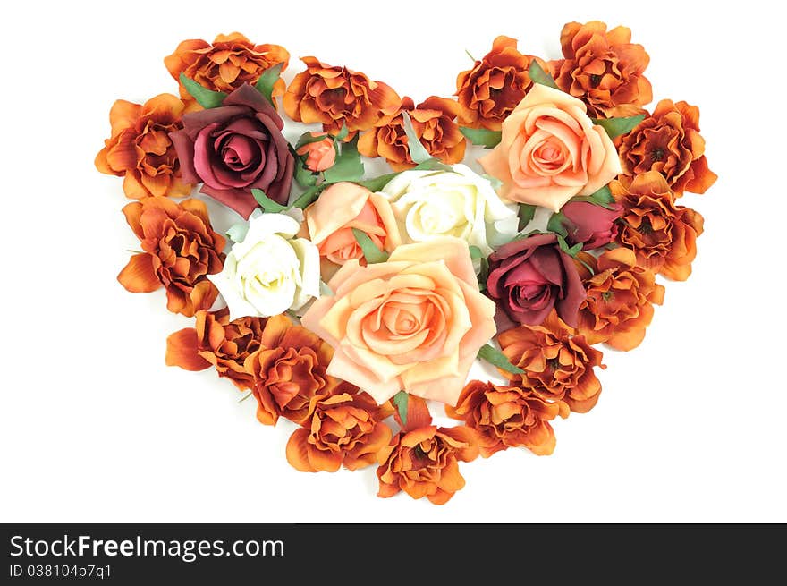 Batch of colorful roses in a heart shape on a white background. Batch of colorful roses in a heart shape on a white background