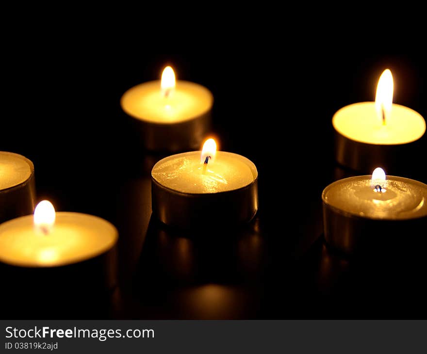 Candles flaming in the dark