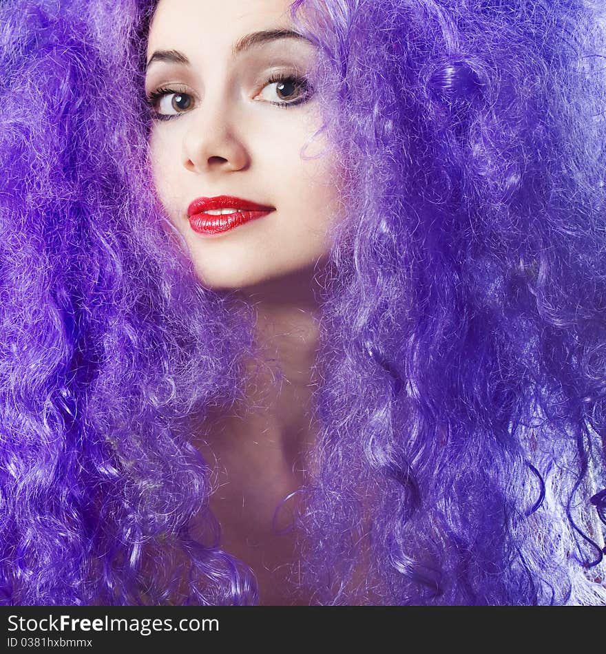 Beautiful young girl with bright violet hair. Beautiful young girl with bright violet hair